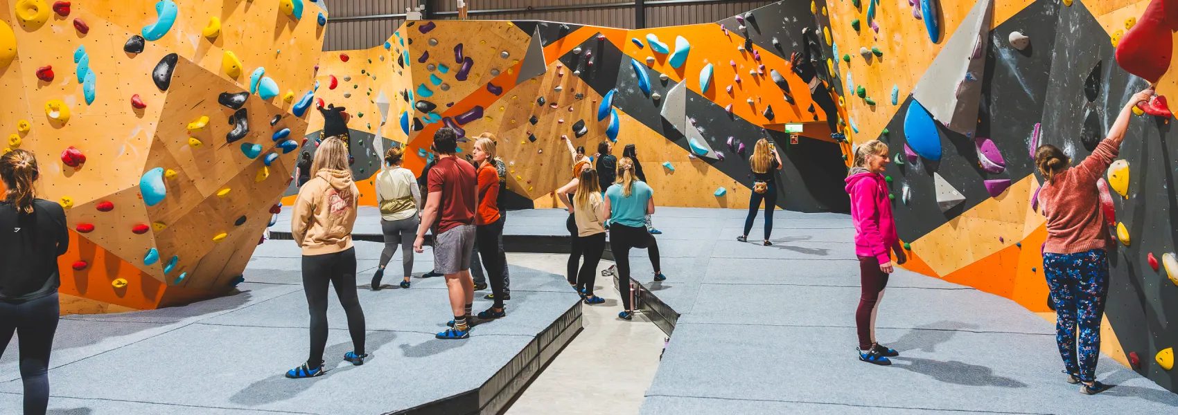 Climbers stand and assess the routes at ChalkUp Bouldering